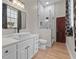 Modern bathroom featuring a white vanity, vessel sink, and glass-enclosed shower at 5910 Lake Emma Ct, Groveland, FL 34736