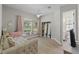 Cozy bedroom with a window seat, closet and an en suite bathroom at 5910 Lake Emma Ct, Groveland, FL 34736
