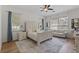 Bright bedroom with a king-size bed and sitting area at 5910 Lake Emma Ct, Groveland, FL 34736