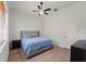 Well-lit bedroom with hardwood floors, a ceiling fan and minimalist decor at 5910 Lake Emma Ct, Groveland, FL 34736
