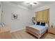 Inviting bedroom with warm wood floors and a comfortable blue bed at 5910 Lake Emma Ct, Groveland, FL 34736