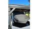Covered boat lift with Nautique boat at 5910 Lake Emma Ct, Groveland, FL 34736