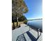 Serene lakeside dock with bench, offering peaceful views at 5910 Lake Emma Ct, Groveland, FL 34736