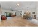 Open living and dining area with hardwood floors and lots of light at 5910 Lake Emma Ct, Groveland, FL 34736