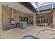 Luxury outdoor kitchen with stainless steel appliances at 5910 Lake Emma Ct, Groveland, FL 34736