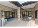 Outdoor patio with seating and brick columns at 5910 Lake Emma Ct, Groveland, FL 34736