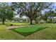 Landscaped backyard putting green at 5910 Lake Emma Ct, Groveland, FL 34736