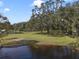 Expansive waterfront property with mature trees and a peaceful, serene setting at 5910 Lake Emma Ct, Groveland, FL 34736
