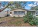 Exterior view of a residential backyard, showing the side of the house with greenery and landscaping at 8862 Sw 92Nd St # D, Ocala, FL 34481