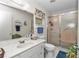 Well-lit bathroom with a marble-top vanity, glass shower, and neutral decor offering a clean and functional space at 8862 Sw 92Nd St # D, Ocala, FL 34481