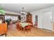 Inviting dining room with a large window, wooden furniture, and a decorative hutch, ideal for Gathering gatherings at 8862 Sw 92Nd St # D, Ocala, FL 34481