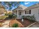 Well-maintained home exterior with manicured landscaping and a charming covered porch at 8862 Sw 92Nd St # D, Ocala, FL 34481