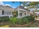 Charming home exterior with a quaint front porch and lush greenery at 8862 Sw 92Nd St # D, Ocala, FL 34481
