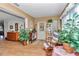 Inviting foyer with wood-look flooring, plants, and decor creating a welcoming entry to the home at 8862 Sw 92Nd St # D, Ocala, FL 34481