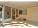 Screened lanai featuring a tiled patio, perfect for outdoor relaxation and entertaining. Includes access door and outdoor window at 8862 Sw 92Nd St # D, Ocala, FL 34481