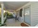 Inviting covered porch with seating, perfect for relaxing outdoors at 8862 Sw 92Nd St # D, Ocala, FL 34481