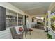 Cozy covered porch with comfortable seating and a view of the neighborhood at 8862 Sw 92Nd St # D, Ocala, FL 34481