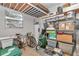 Basement storage room with extensive shelving and organized storage. Features a utility water heater at 8862 Sw 92Nd St # D, Ocala, FL 34481