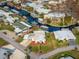 Aerial view of a waterfront home with a private boat dock along canal at 920 Morningview Dr, Tavares, FL 32778