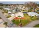 Aerial view of a single-story home with manicured lawn and direct waterfront access at 920 Morningview Dr, Tavares, FL 32778