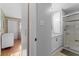 Bathroom with marble sink, tile floors, walk-in shower and neutral paint at 920 Morningview Dr, Tavares, FL 32778