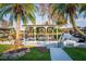 Private covered boat dock featuring a serene waterfront view with a white table set at 920 Morningview Dr, Tavares, FL 32778
