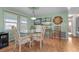 Cozy dining room features a glass-top table and unique decor at 920 Morningview Dr, Tavares, FL 32778