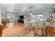 Open dining area adjacent to the living space featuring a glass table at 920 Morningview Dr, Tavares, FL 32778