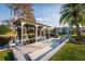 A covered dock with a boat lift sits on the water, offering a relaxing waterfront atmosphere and scenic views at 920 Morningview Dr, Tavares, FL 32778