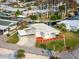 Waterfront home with a covered carport and a well-manicured lawn along canal at 920 Morningview Dr, Tavares, FL 32778