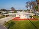 Charming single-story home featuring a covered carport and landscaped front yard at 920 Morningview Dr, Tavares, FL 32778