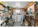 Laundry room with washer and dryer surrounded by shelving for storage at 920 Morningview Dr, Tavares, FL 32778