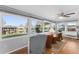 Cozy sunroom with views of canal, lots of natural light, and ceiling fan at 920 Morningview Dr, Tavares, FL 32778