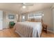 Bright bedroom featuring a cozy bed, natural light, closet, and adjoining bathroom at 920 Morningview Dr, Tavares, FL 32778