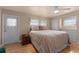 Bedroom with a large bed, side table, and storage unit, offering a serene retreat at 920 Morningview Dr, Tavares, FL 32778