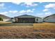 Backyard with a screened-in porch and plenty of space at 5449 Dray Dr, The Villages, FL 32163
