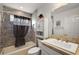 Neutral-toned bathroom with shower, vanity, mirror and decorative accents at 5449 Dray Dr, The Villages, FL 32163