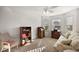 Bright bedroom with a floral sofa and natural light at 5449 Dray Dr, The Villages, FL 32163