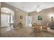 Bright dining area features neutral tones, ceiling fan, and adjacent entry at 5449 Dray Dr, The Villages, FL 32163