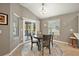 Cozy dining room with natural light and sliding door to backyard at 5449 Dray Dr, The Villages, FL 32163