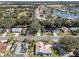 An elevated view of a charming house in a neighborhood near a golf course and tranquil lake at 1001 Del Rio Dr, The Villages, FL 32159