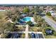 Aerial view of the Rio Grande Gathering pool, showcasing a refreshing oasis with lush landscaping and convenient parking at 1001 Del Rio Dr, The Villages, FL 32159