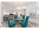 Cozy dining area with glass table, colorful rug, and natural light at 1001 Del Rio Dr, The Villages, FL 32159