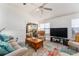 Bright living room features vaulted ceilings, wood-look floors and a sliding door at 1001 Del Rio Dr, The Villages, FL 32159