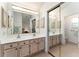 Main bathroom featuring double sink vanity, mirror and tiled floor at 1001 Del Rio Dr, The Villages, FL 32159