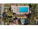 Aerial view of the community pool, clubhouse, tennis courts and surrounding landscape at 10301 Us Highway 27 # 16, Clermont, FL 34711