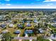 Aerial view of the home in a well-maintained neighborhood with mature trees and landscaping at 10338 Se 178Th St, Summerfield, FL 34491