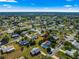 Aerial view of home surrounded by beautiful, well maintained homes, mature trees and landscaping at 10338 Se 178Th St, Summerfield, FL 34491