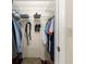 Well-organized closet with shelving, hanging rods, and shoe rack for optimal storage solutions at 10338 Se 178Th St, Summerfield, FL 34491