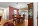 Dining space featuring a wood table set, built-in cabinet, and access to a screened lanai at 10338 Se 178Th St, Summerfield, FL 34491